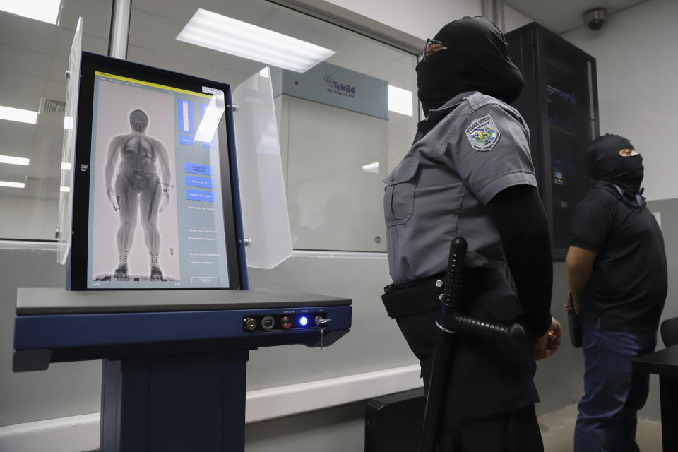 A body screening device used to register inmates stands on display during a media tour of the Terrorism Confinement Center during a media tour in Tecoluca, El Salvador, Thursday, Feb. 2, 2023. The "mega-prison" still under construction has a maximum capacity of 40,000 and is intended to imprison gang members, according to the government. (AP Photo/Salvador Melendez)