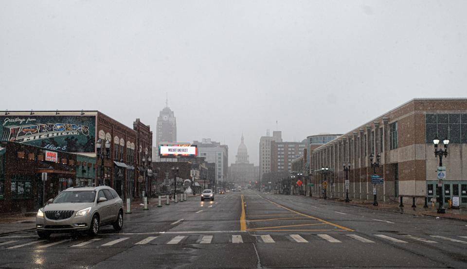 Snow flurries obscure the view of the State Capitol, Friday afternoon, Jan. 12, 2024.