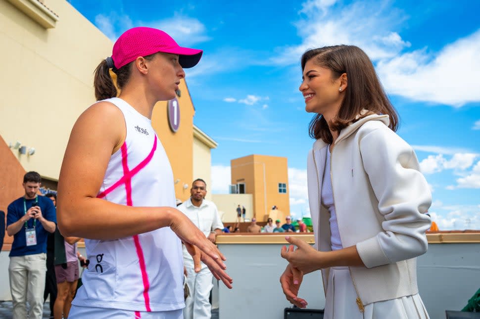 Iga Swiatek (L) of Poland meets actress Zendaya after defeating Maria Sakkari of Greece in the women's singles final of the BNP Paribas Open at Indian Wells Tennis Garden on March 17, 2024 in Indian Wells, California