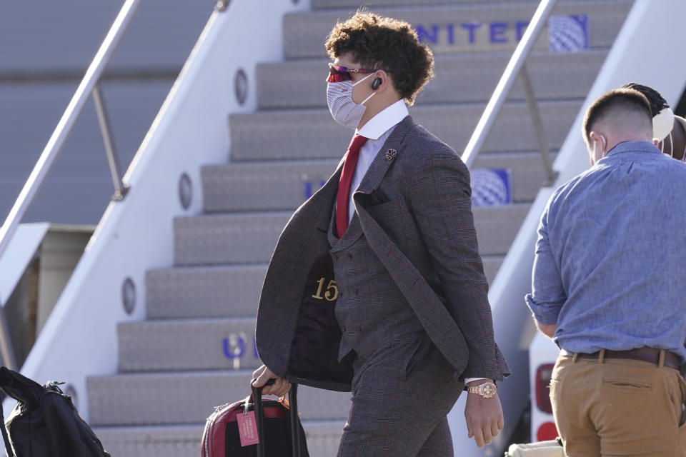 Kansas City Chiefs quarterback Patrick Mahomes arrives with his teammates for the NFL Super Bowl 55 football game against the Tampa Bay Buccaneers, Saturday, Feb. 6, 2021, in Tampa, Fla. (AP Photo/Charlie Riedel)