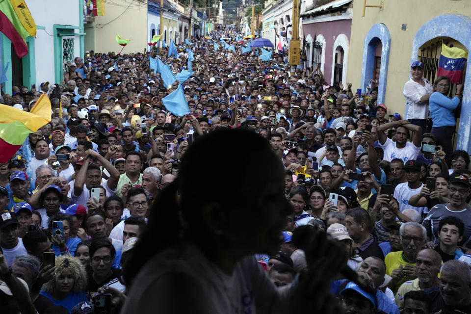 FILE - Opposition presidential hopeful Maria Corina Machado speaks to supporters at a rally in Valencia, Carabobo State, Venezuela, Oct. 5, 2023. The opposition will hold a primary on Oct. 22 to chose one candidate to face President Nicolas Maduro in 2024 general elections. (AP Photo/Ariana Cubillos, File)