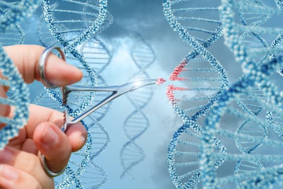 Someone using tweezers to remove part of a digital DNA strand.