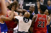 <p>Toronto Raptors forward Serge Ibaka (9) lands a strike on Chicago Bulls center Robin Lopez (8) during a scuffle during second half of an NBA basketball game in Toronto, Tuesday, March 21, 2017. (Frank Gunn/The Canadian Press via AP) </p>