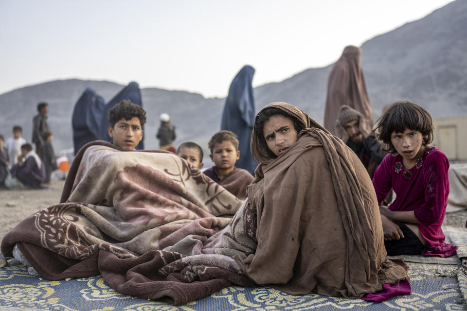 Afghan refugees settle in a camp near the Torkham Pakistan-Afghanistan border in Torkham, Afghanistan, Saturday, Nov. 4, 2023. A huge number of Afghans refugees entered the Torkham border to return home hours before the expiration of a Pakistani government deadline for those who are in the country illegally to leave or face deportation. (AP Photo/Ebrahim Noroozi)