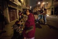 <p>People gather on a street in downtown Mexico City during an earthquake on September 7, 2017. (Pedro Pardo/AFP/Getty Images) </p>