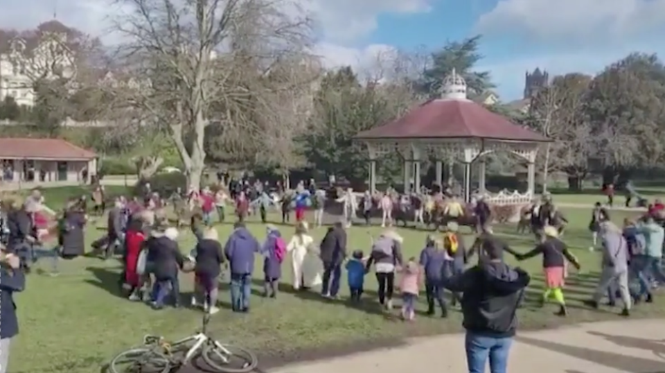 Footage captured the group signing and holding hands in a circle on an area of grass in Alexandra Park, Hastings on Saturday morning. (BBC Sussex)