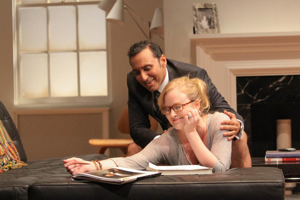 This theater image released by Philip Rinaldi Publicity shows Aasif Mandvi, left, and Heidi Armbruster in a scene from the "Disgraced" in New York. (AP Photo/Philip Rinaldi Publicity, Erin Baiano)