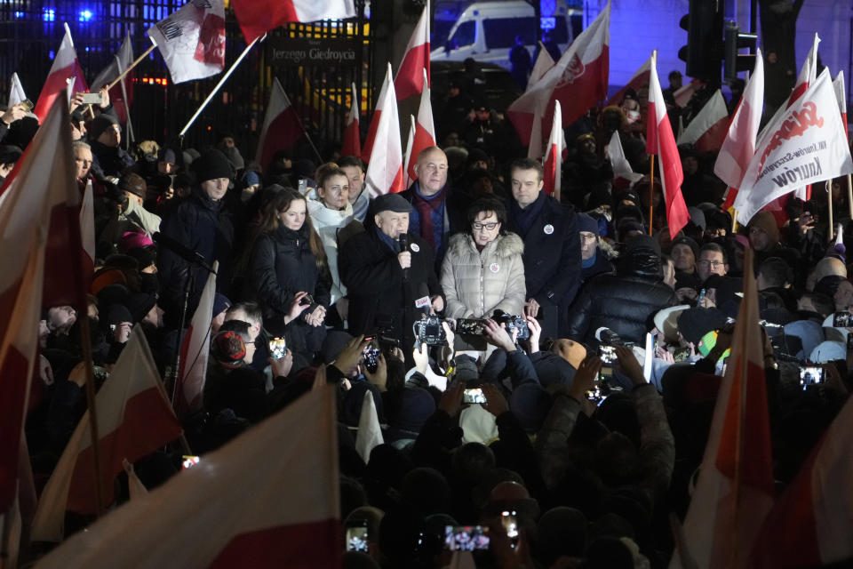 Jaroslaw Kaczynski, center, leader of right-wing Law and Justice party that lost power in the October parliamentary elections protest the moves by the new pro-European Union government which has taken control of state media, in front of the parliament building in Warsaw, Poland, on Thursday, Jan 11, 2024. Law and Justice, frustrated over the loss of power is seeking to undermine the actions of the new government of Prime Minister Donald Tusk. (AP Photo/Czarek Sokolowski)