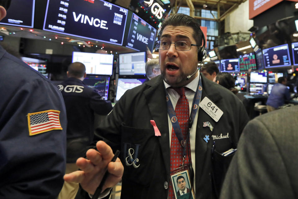 Trader Michael Capolino works on the floor of the New York Stock Exchange, Friday, Dec. 13, 2019. After months of waiting, markets had a muted reaction to news Friday that the US and China had reached an initial deal on trade. (AP Photo/Richard Drew)