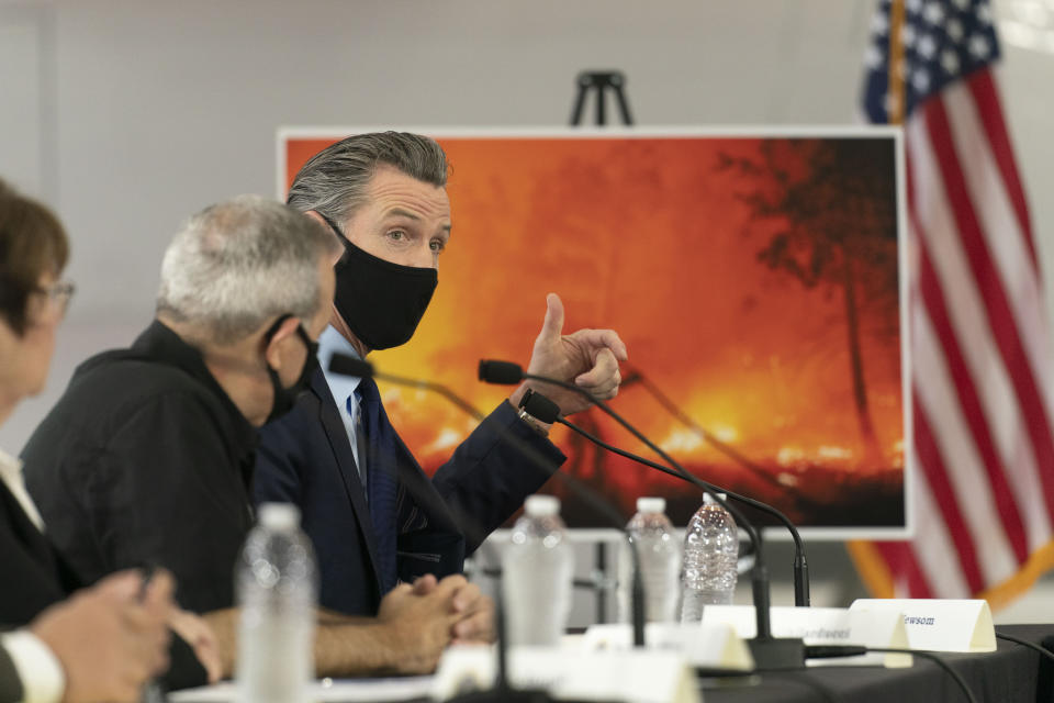 California Gov. Gavin Newsom speaks during a briefing with President Donald Trump at Sacramento McClellan Airport, in McClellan Park, Calif., Monday, Sept. 14, 2020, on the wildfires. (AP Photo/Andrew Harnik)