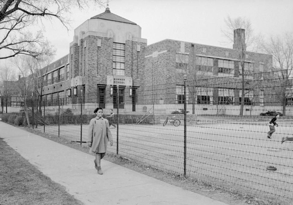 PHOTO: 9-year-old African-American student Linda Brown as she walks past Sumner Elementary School, Topkea, Kansas, 1953.  (Carl Iwasaki/Getty Images)
