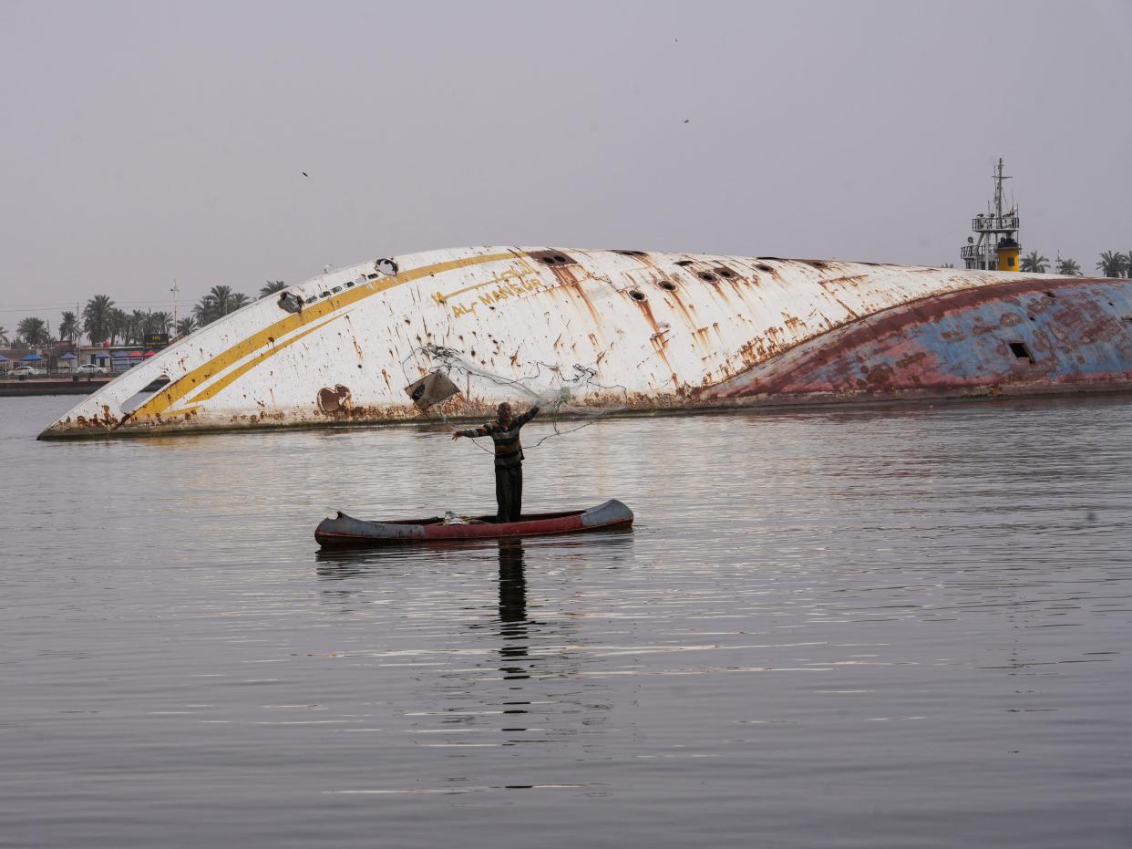 An aerial view of the 'Al-Mansur' yacht, once belonging to former Iraqi President Saddam Hussein, which has been lying on the water bed for years in the Shatt al-Arab waterway, in Basra.