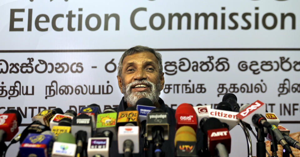 Sri Lanka's elections chief Mahinda Deshapriya speaks during a press conference in Colombo, Sri Lanka, Wednesday, Oct. 16, 2019. Deshapriya says he has asked for an explanation from the defense ministry on why the army commander features in an advertisement promoting a candidate for next month's presidential election. The advertisement, which appeared in a newspaper last weekend, had comments made by Lt. Gen. Shavendra Silva, the current army chief, in 2009 praising presidential candidate Gotabaya Rajapaksa for his role in ending the country's long civil war. (AP Photo/Eranga Jayawardena)