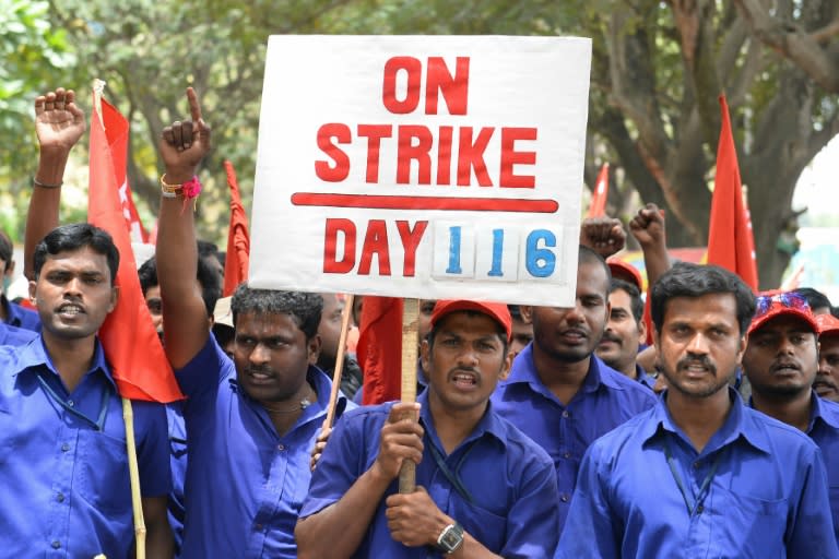 Trade union activists shout slogans during a protest rally called by Centre of India Trade Unions (CITU) against the central government's economic policies in Bangalore, southern India, on September 2, 2015