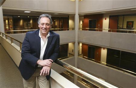 Attorney Bryan Mick, whose law firm Mick & Associates provides due diligence reports, poses at his office in Omaha, Nebraska January 13, 2014. REUTERS/ Lane Hickenbottom