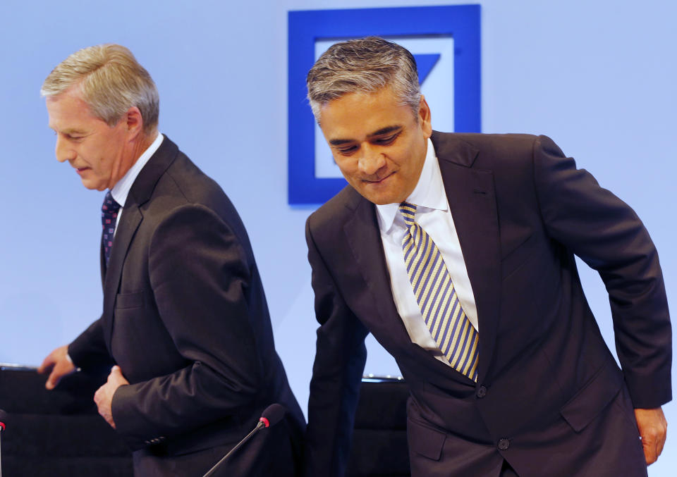 CEOs of Deutsche Bank Anshu Jain, right, and Juergen Fitschen take a seat at the beginning of a press conference in Frankfurt, Germany, Tuesday, Sept. 11, 2012. The Deutsche Bank announced its strategy and ambition for the next years. (AP Photo/Michael Probst)