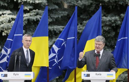 NATO Secretary General Jens Stoltenberg and Ukrainian President Petro Poroshenko attend a joint news conference following a meeting of the NATO-Ukraine Commission in Kiev, Ukraine, July 10, 2017. REUTERS/Valentyn Ogirenko