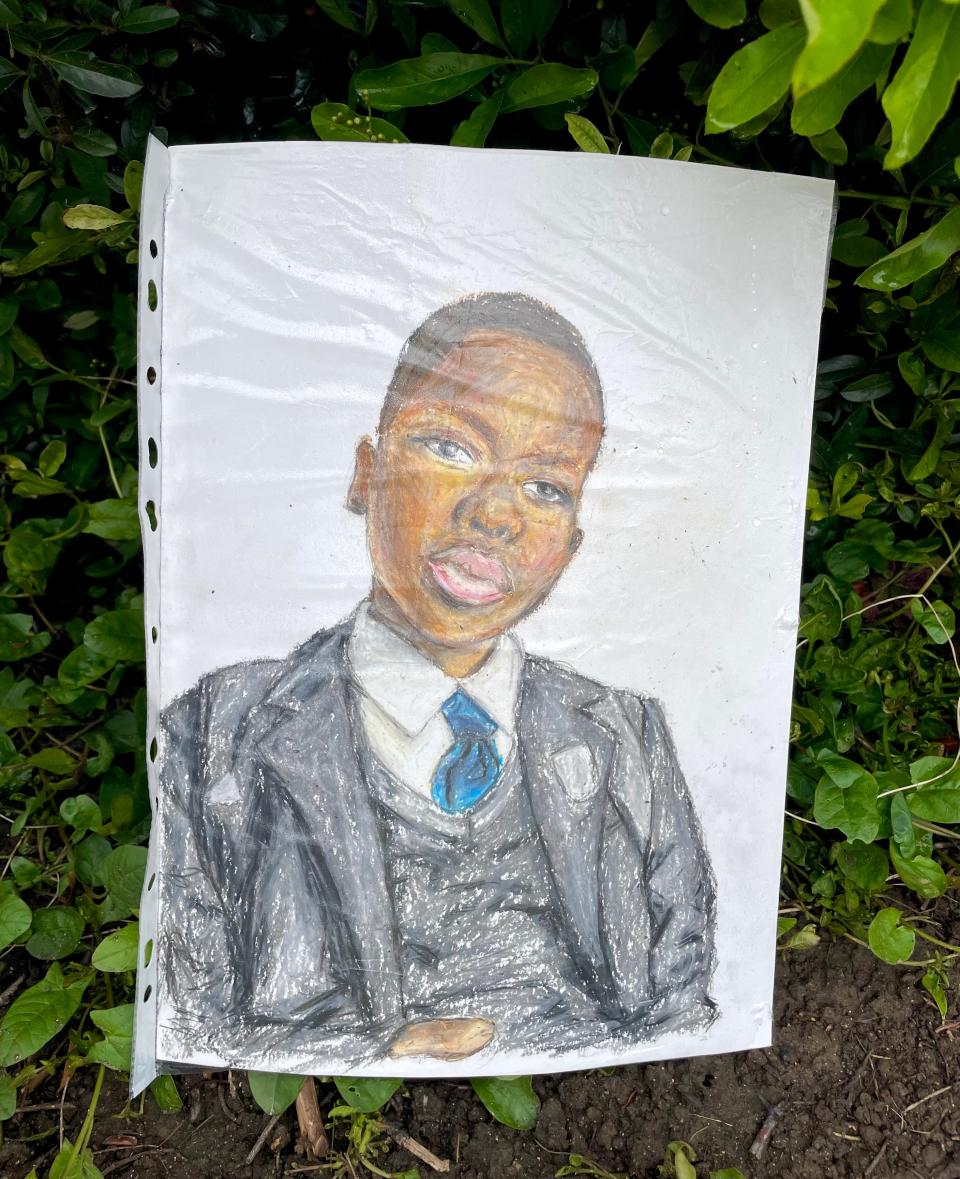 Artwork left with flowers near the scene in Hainault, north east London, where 14-year-old Daniel Anjorin was killed in a sword attack on Tuesday (Samuel Montgomery/PA Wire)