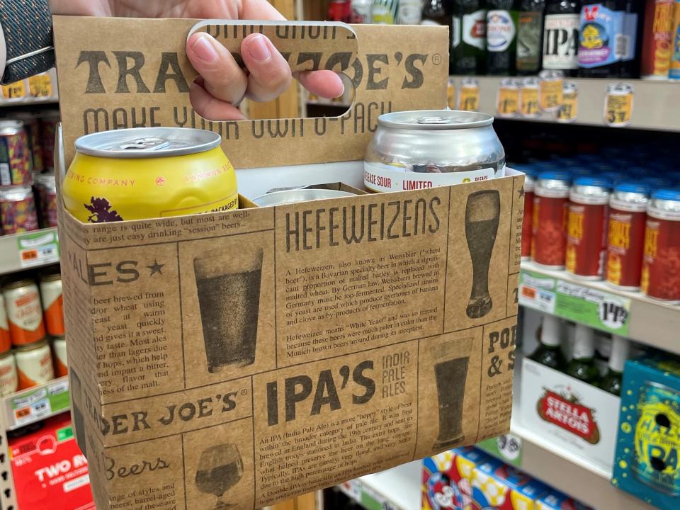 trader joe's beer six pack cardboard holder in aisle