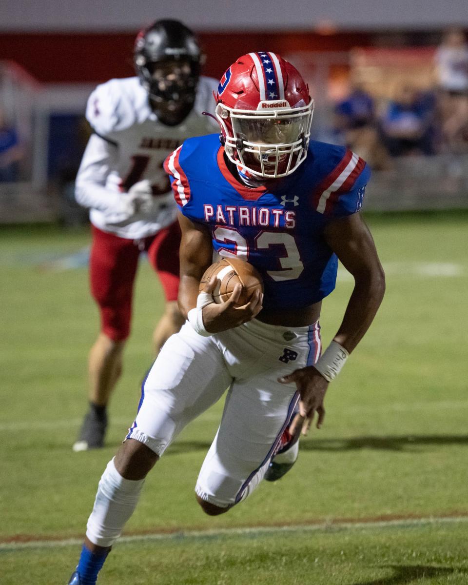 Brayden Gates (23) carries the ball after making an interception during the West Florida vs Pace football game at Pace High School on Friday, Sept. 9, 2022.