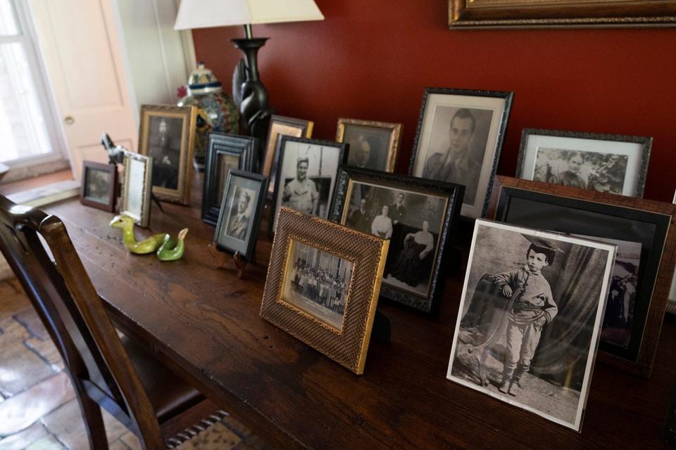 Family photos displayed in Elizabeth Crook's home. She has stories about all her ancestors, including those who were involved in the history of H-E-B and in major charitable causes.