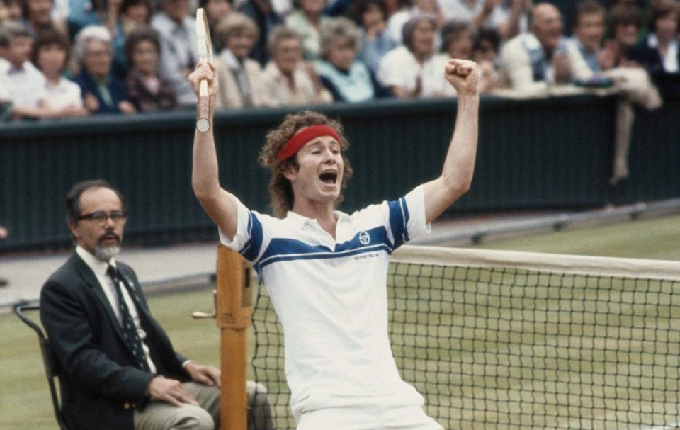 John McEnroe celebrates defeating Bjorn Borg in the 1981 Wimbledon final - GETTY IMAGES