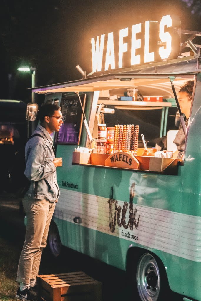 Black man ordering at a food truck