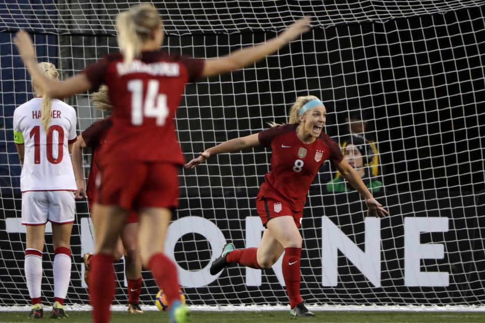 Julie Ertz (R) reacts after scoring against Denmark during the first half of an international friendly soccer match. (AP)
