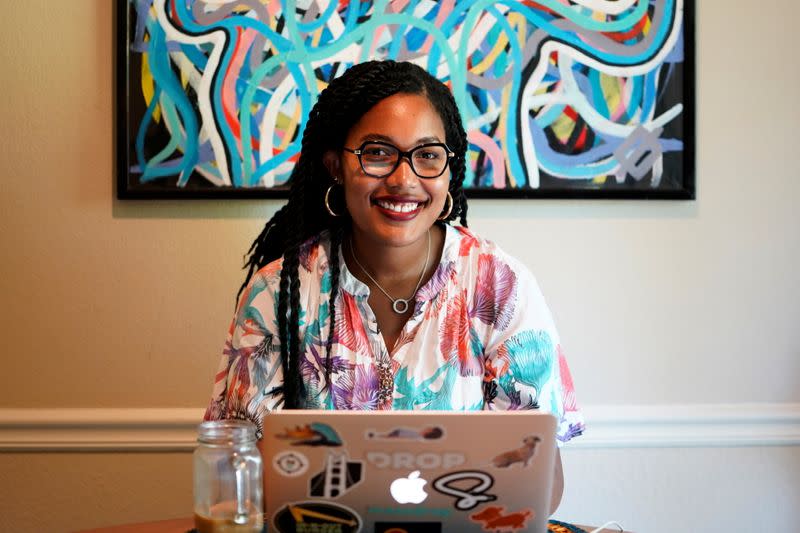 Jaleesa Garland, a marketing manager at an e-commerce startup, poses for a portrait in her apartment in Tulsa