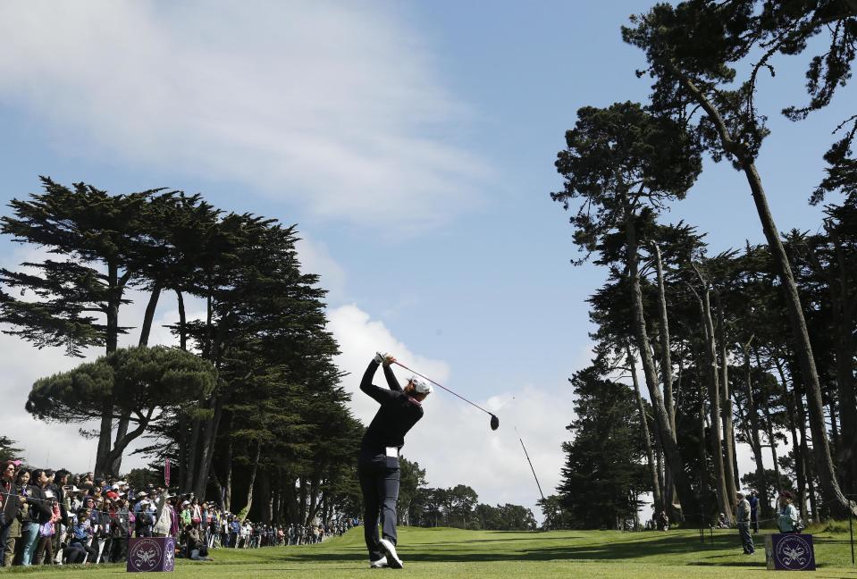 Lydia Ko, of New Zealand, follows her drive from the sixth tee of Lake Merced Golf Club during the final round of the Swinging Skirts LPGA Classic golf tournament on Sunday, April 27, 2014, in Daly City, Calif. (AP Photo/Eric Risberg)