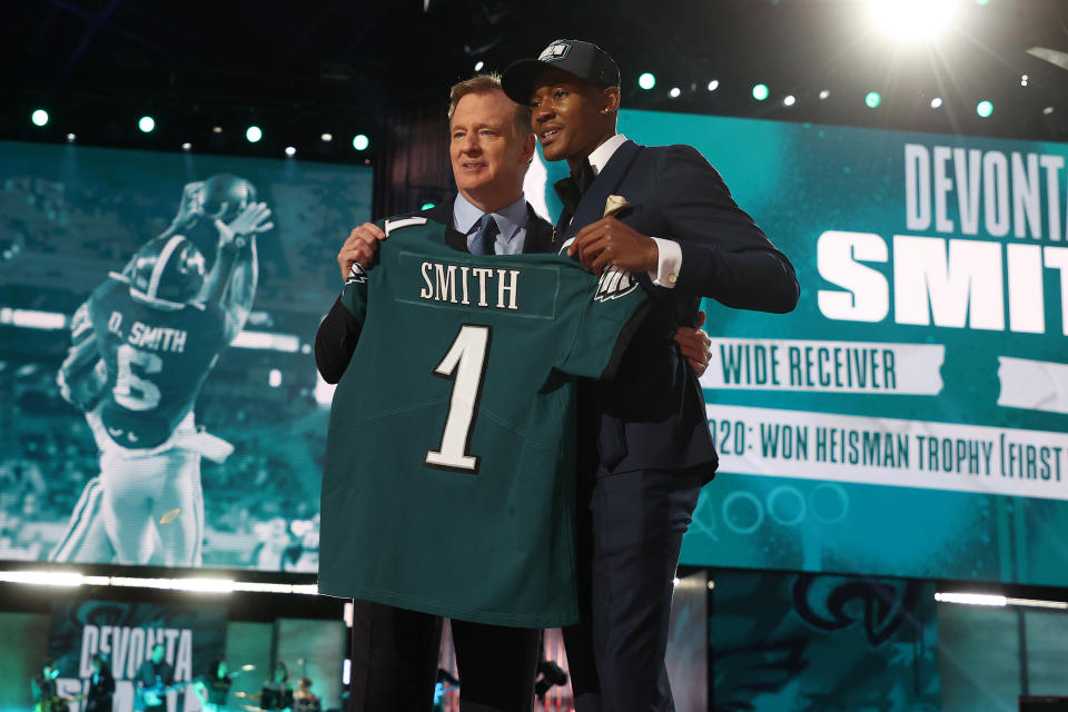 CLEVELAND, OHIO - APRIL 29: DeVonta Smith poses with NFL Commissioner Roger Goodell onstage after being selected 10th by the Philadelphia Eagles during round one of the 2021 NFL Draft at the Great Lakes Science Center on April 29, 2021 in Cleveland, Ohio. (Photo by Gregory Shamus/Getty Images)