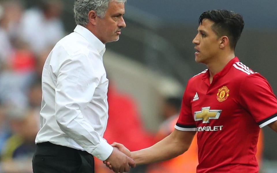 Jose Mourinho shakes hands with goalscorer Alexis Sanchez during Saturday's FA Cup semi-final - Getty Images Europe
