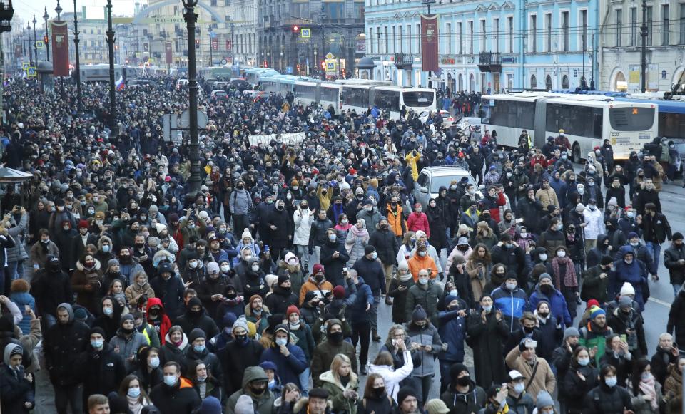 People march during a protest against the jailing of opposition leader Alexei Navalny in St.Petersburg, Russia, Saturday, Jan. 23, 2021. Russian police are arresting protesters demanding the release of top Russian opposition leader Alexei Navalny at demonstrations in the country's east and larger unsanctioned rallies are expected later Saturday in Moscow and other major cities. (AP Photo/Dmitri Lovetsky)