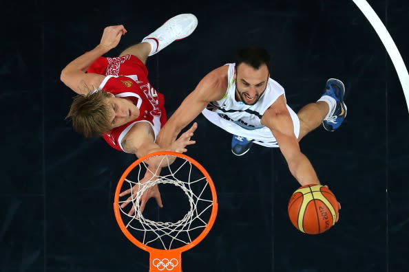 LONDON, ENGLAND - AUGUST 12: Manu Ginobili #5 of Argentina drives to the basket against Andrey Kirilenko #15 of Russia during the Men's Basketball bronze medal game between Russia and Argentina on Day 16 of the London 2012 Olympics Games at North Greenwich Arena on August 12, 2012 in London, England. (Photo by Christian Petersen/Getty Images)