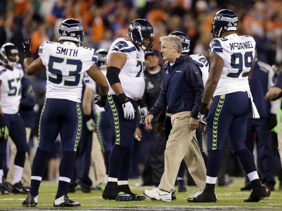 Seattle Seahawks head coach Pete Carroll walks on the field before the NFL Super Bowl XLVIII football game against the Denver Broncos, Sunday, Feb. 2, 2014, in East Rutherford, N.J. (AP Photo/Jeff Roberson)