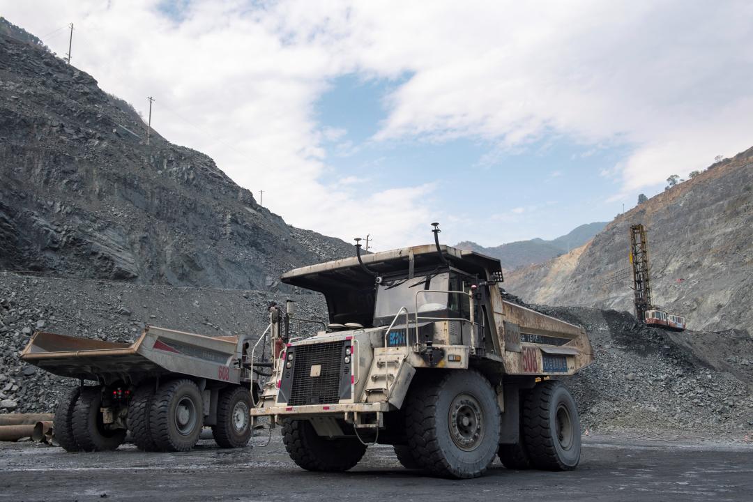 This photo taken on April 11, 2024 shows unmanned trucks at an iron ore mine branch of Pangang Group in Panzhihua City, southwest China's Sichuan Province. Pangang Group Co., Ltd. is an extra-large vanadium, titanium and  steel enterprise in southwest China. In recent years, the company has continuously promoted high-end, intelligent and green development.Our reporters recently visited various production branches of Pangang Group Co., Ltd. to observe its efforts to develop new quality productive forces and promote high-quality development. (Photo by Zhang Haofu/Xinhua via Getty Images)