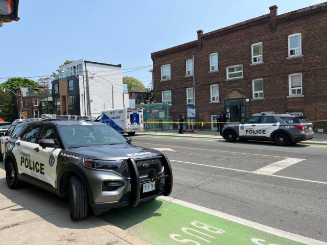 Police received a call for &#39;an unknown trouble&#39; in a unit located in the complex near Harbord Street and Ossington Avenue shortly before noon on Sunday.  (Alexis Raymon/CBC - image credit)