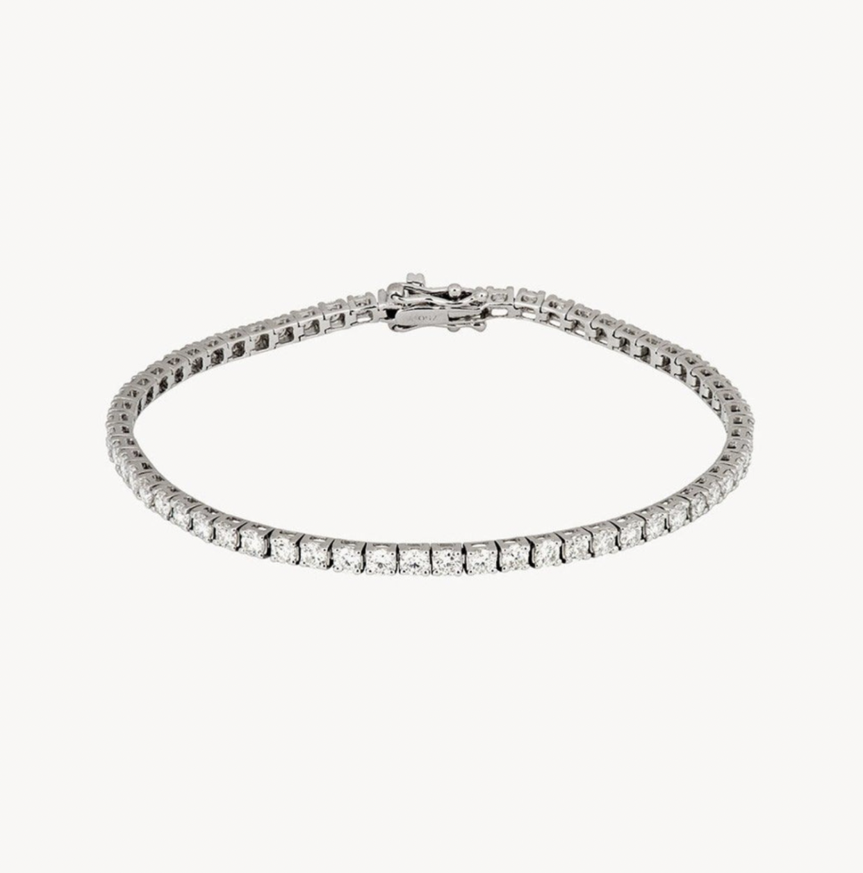 <p><a href="https://roxannefirst.com/en-us/collections/tennis-bracelets/products/white-diamond-tennis-bracelet" rel="nofollow noopener" target="_blank" data-ylk="slk:Shop Now;elm:context_link;itc:0;sec:content-canvas" class="link rapid-noclick-resp">Shop Now</a></p><p>White Diamond Tennis Bracelet</p><p>roxannefirst.com</p><p>$5878.00</p>