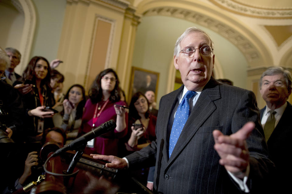 Senate Majority Leader Mitch McConnell, R-Ky., center, accompanied by Sen. Roy Blunt, R-Mo., right, speaks to reporters Tuesday, Dec. 10, 2019, on Capitol Hill in Washington. (AP Photo/Andrew Harnik)