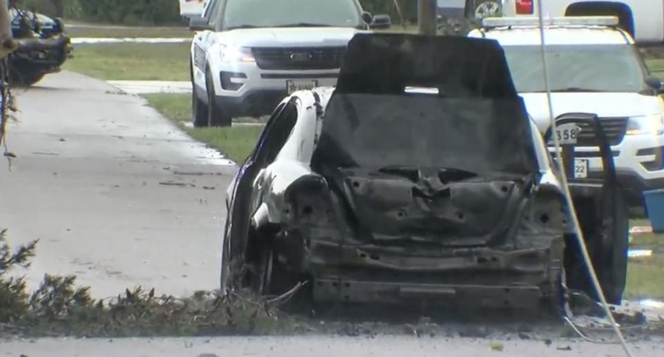 Valentina Tomashosky's car is seen after it was burned.