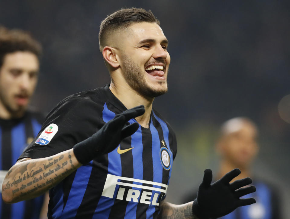 Inter Milan's Mauro Icardi celebrates after scoring his team's first goal on a penalty kick during an Italian Serie A soccer match between Inter Milan and Udinese, at the San Siro stadium in Milan, Italy, Saturday, Dec. 15, 2018. (AP Photo/Antonio Calanni)