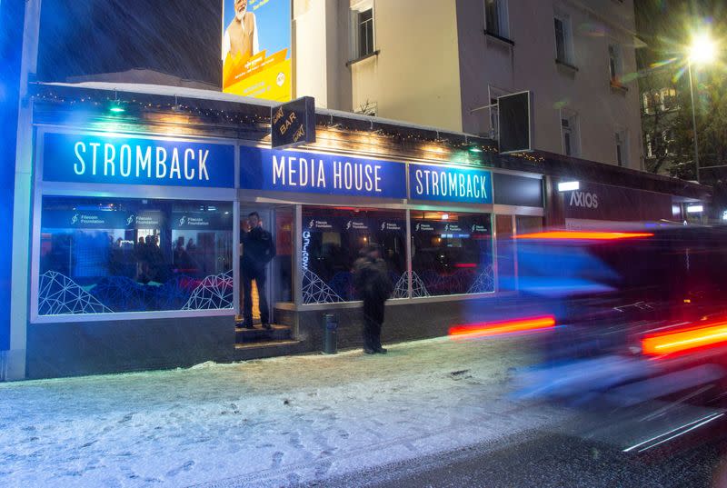 A car drives past a temporary showroom of Stromback during the World Economic Forum in Davos