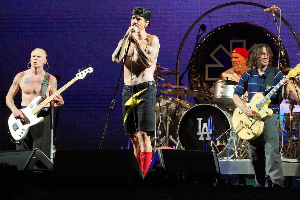 <p>Kevin Mazur/Getty Images</p> Flea, Anthony Kiedis, Chad Smith, and John Frusciante of Red Hot Chili Peppers