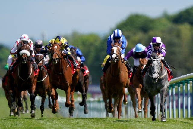 Contact (right) ridden by jockey Ben Curtis on their way to winning the Betfred Double Delight Handicap at Haydock