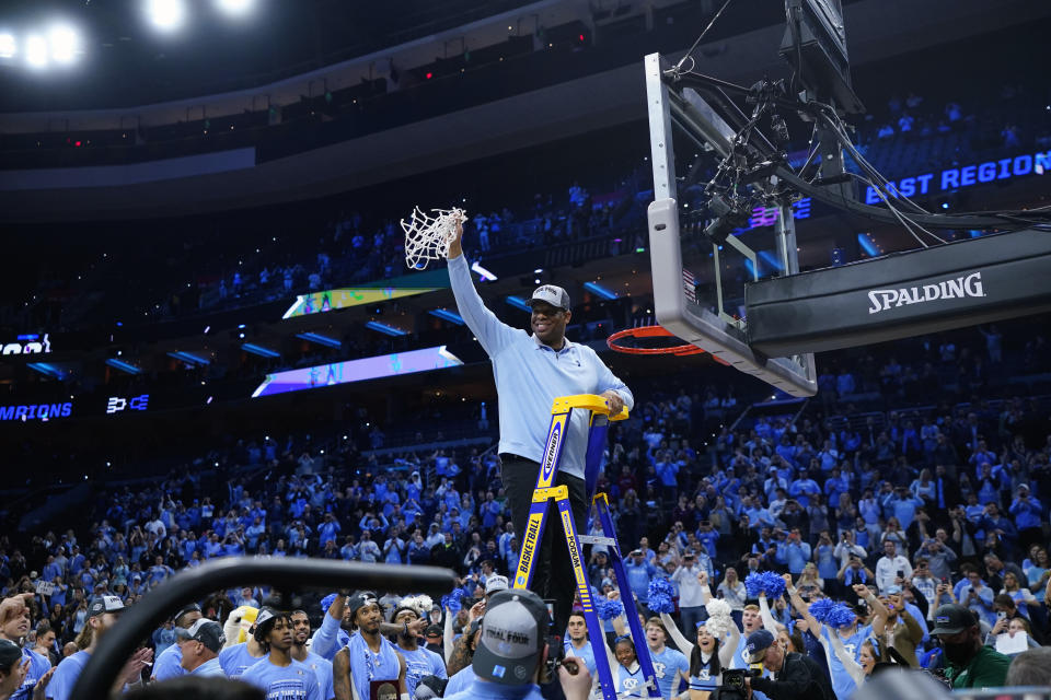 North Carolina's Hubert Davis celebrates after North Carolina won a college basketball game against St. Peter's in the Elite 8 round of the NCAA tournament, Sunday, March 27, 2022, in Philadelphia. (AP Photo/Chris Szagola)