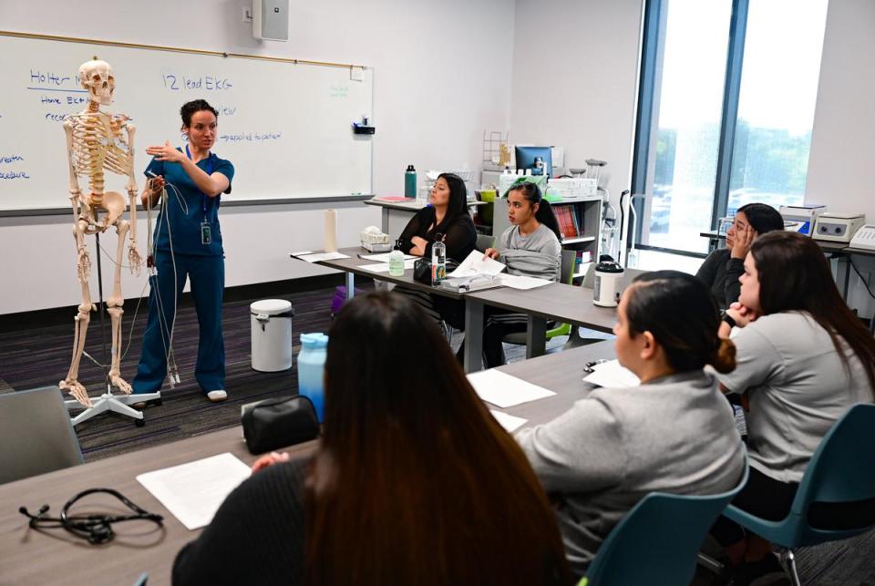 Jennifer Waldron, a Continuing Education instructor at Austin Community College, shows students where to put the electrodes when doing an EKG at ACC’s Leander campus on Oct. 4. The students were participating in a healthcare apprenticeship program for Baylor Scott & White employees.