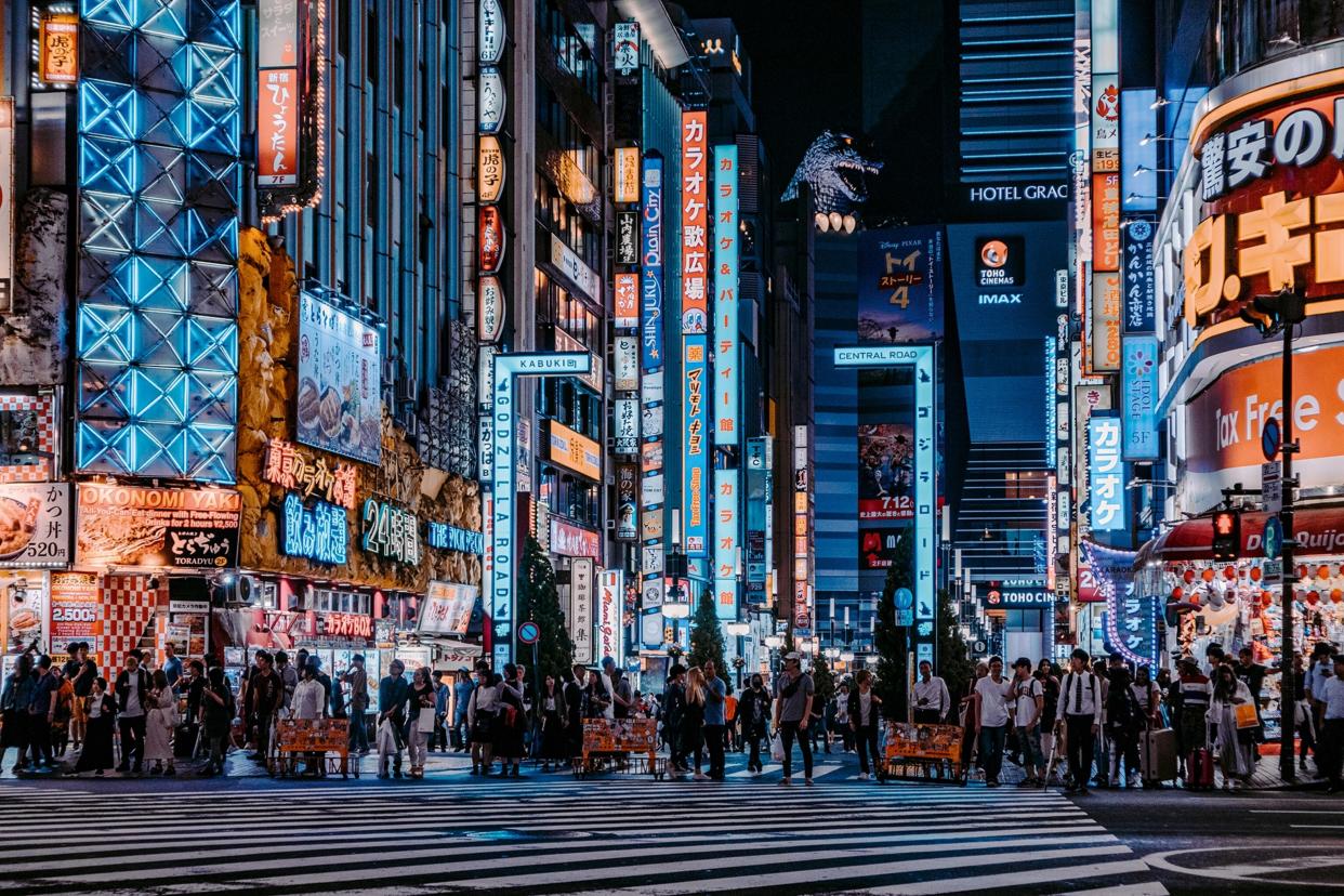 In the streets of Japan's most famous nightlife district, Kabukichō, a Godzilla figure appears from the roof of the Hotel Gracery Shinjuku in Tokyo.