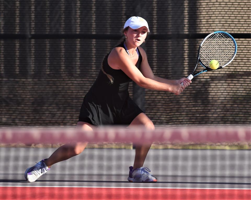 Wylie's Stealey Crousen runs down a shot against teammates Marshall McPherson and Carly Bontke in the Region I-5A mixed doubles finals.