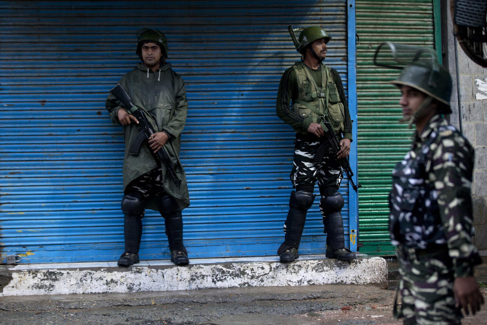 Indian paramilitary soldiers stand guard during security lockdown in Srinagar, Indian controlled Kashmir, Wednesday, Aug. 14, 2019. India has maintained an unprecedented security lockdown to try to stave off a violent reaction to Kashmir's downgraded status. Protests and clashes have occurred daily, thought the curfew and communications blackout have meant the reaction is largely subdued. (AP Photo/ Dar Yasin)