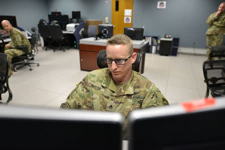 Staff Sergeant Justin Taylor, Weapons Operator, 49th Fire Direction Center, performs missile defense exercises at the Ft. Greely missile defense complex in Fort Greely, Alaska, U.S., April 26, 2018. REUTERS/Mark Meyer